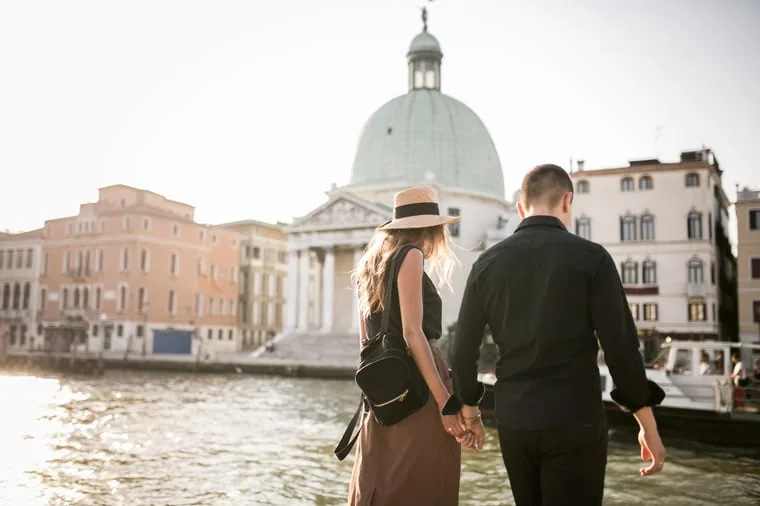 Couple walking a European square